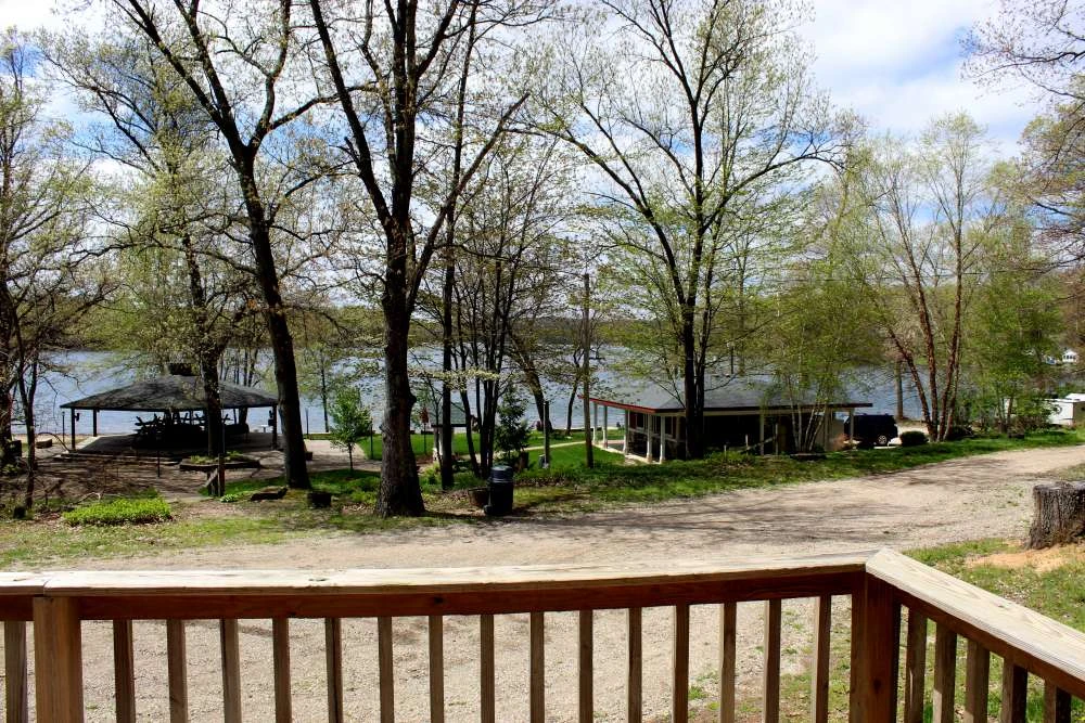 View across the lake at Gaŗezers with the pavilion and trees